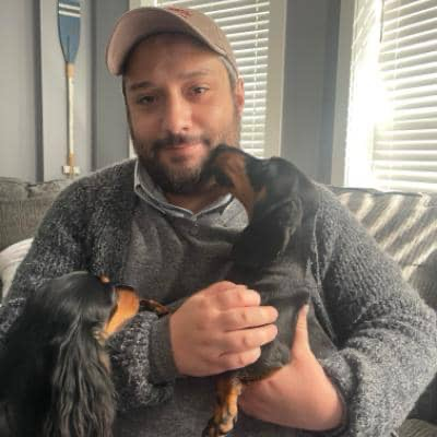 David holding two dogs
